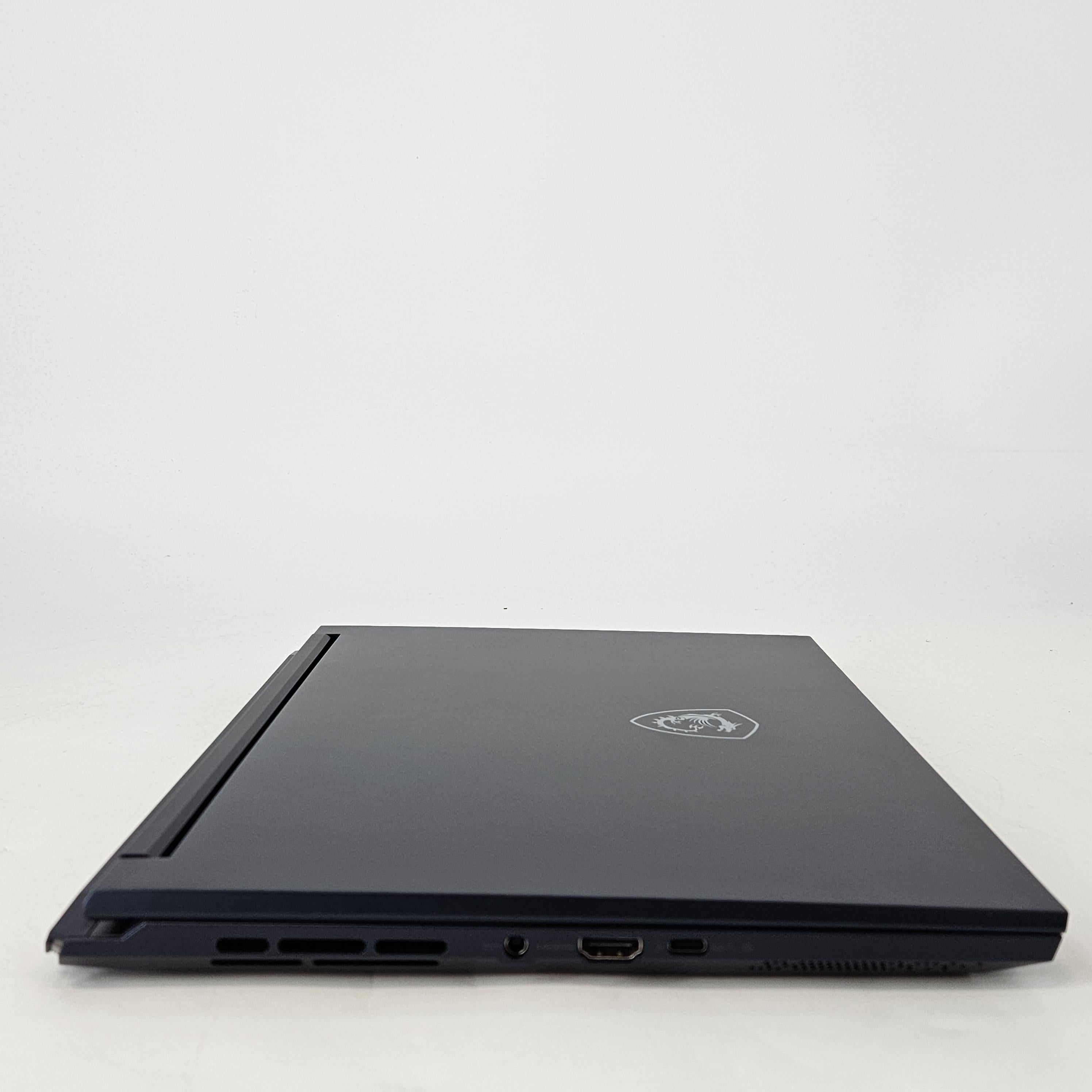 MSI Stealth 14 Studio 14 Blue 2.4 GHz Intel Core i7 13th Gen. 16GB RAM 1TB Solid State Drive NVIDIA GeForce RTX 4060 8 GB